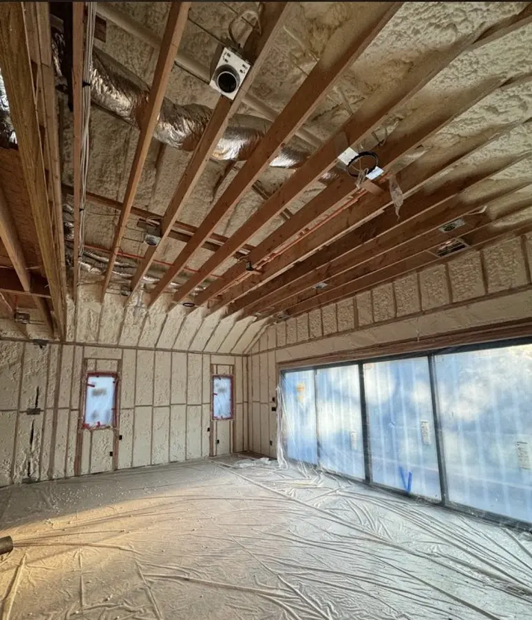 Interior walls and ceiling insulated with spray foam during new construction in Pike Creek Valley